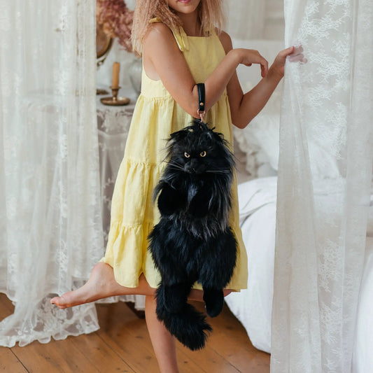 Chongker Maine Coon Cat Backpack black faux fur daypack worn by child in yellow dress on Tampa Home & Garden Store