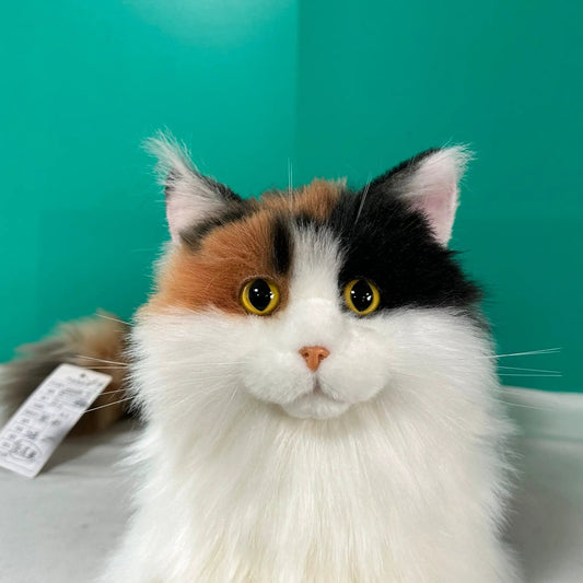 Plush calico cat head, handmade life-size memorial with white fur and bright yellow eyes on Tampa Home & Garden Store