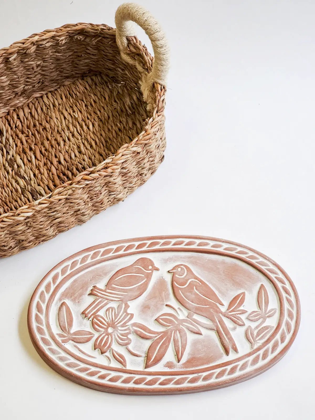 Bread warmer and oval Lovebirds basket in natural woven fibers on Tampa Home & Garden Store
