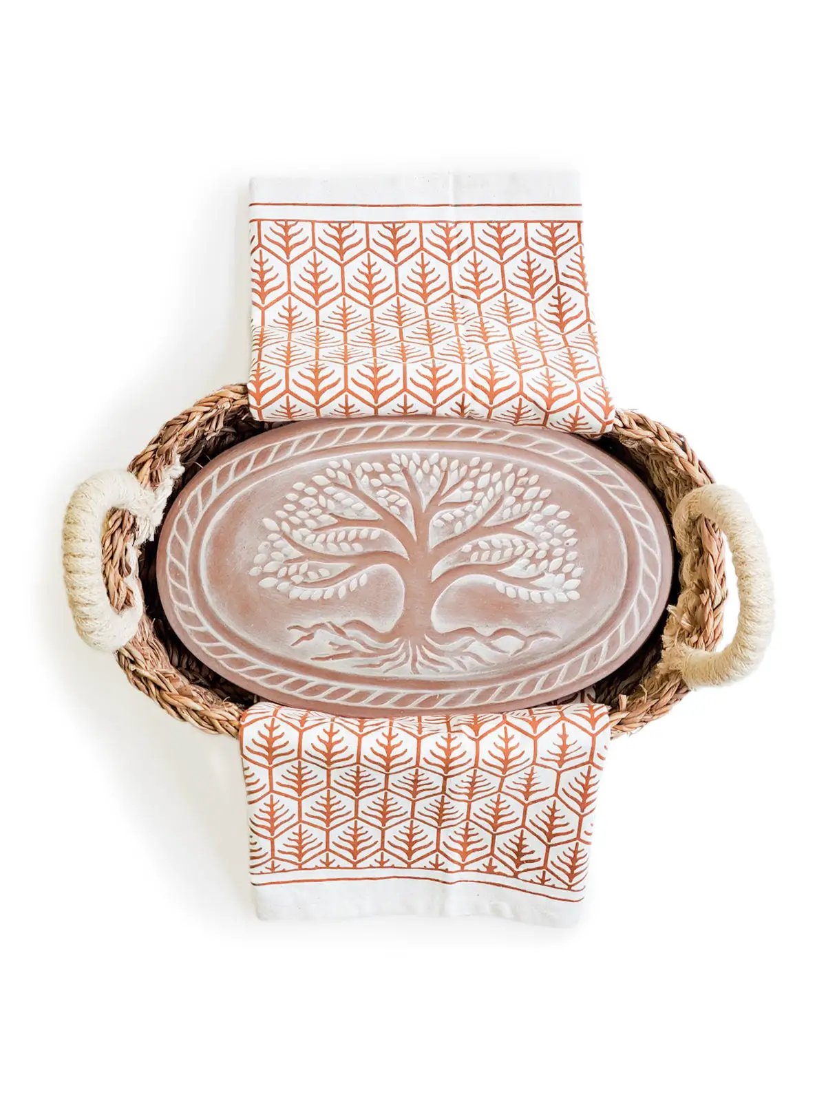 Terracotta bread warmer on a woven basket tray with rope handles and two orange leaf tea towels on Tampa Home & Garden Store
