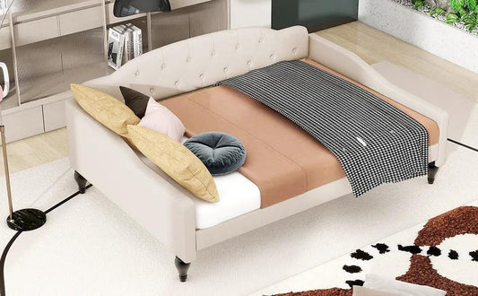 Full size upholstered tufted beige daybed with curved back, pillows and a black-white throw on Tampa Home & Garden Store