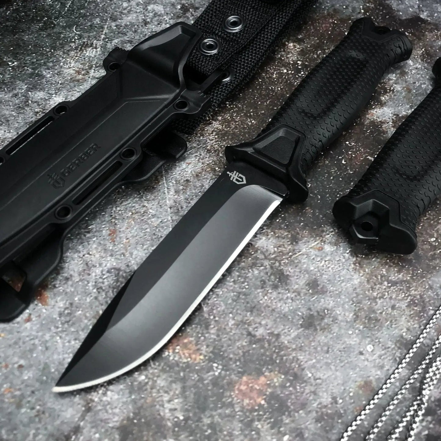Goebel Infantry Wilderness Survival Knife with black fixed blade and textured grip sheath on Tampa Home & Garden Store