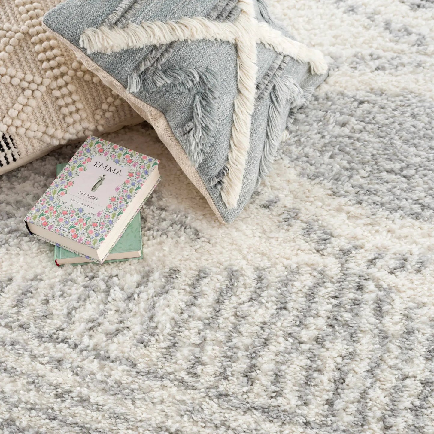 Trunding Plush Area Rug Gray Shag with cream fringe, layered on beige textured rug Boutique Rugs on Tampa Home & Garden Store