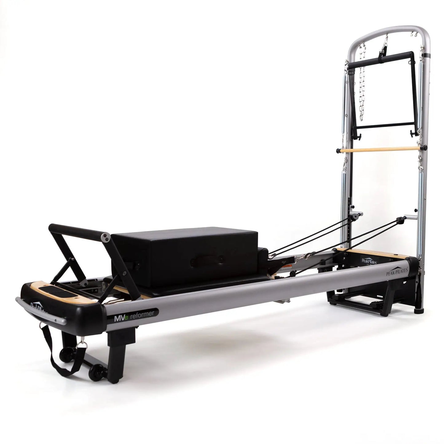 MVe Reformer and Tower Pilates machine by Peak Pilates with silver frame and black padding on Tampa Home & Garden Store
