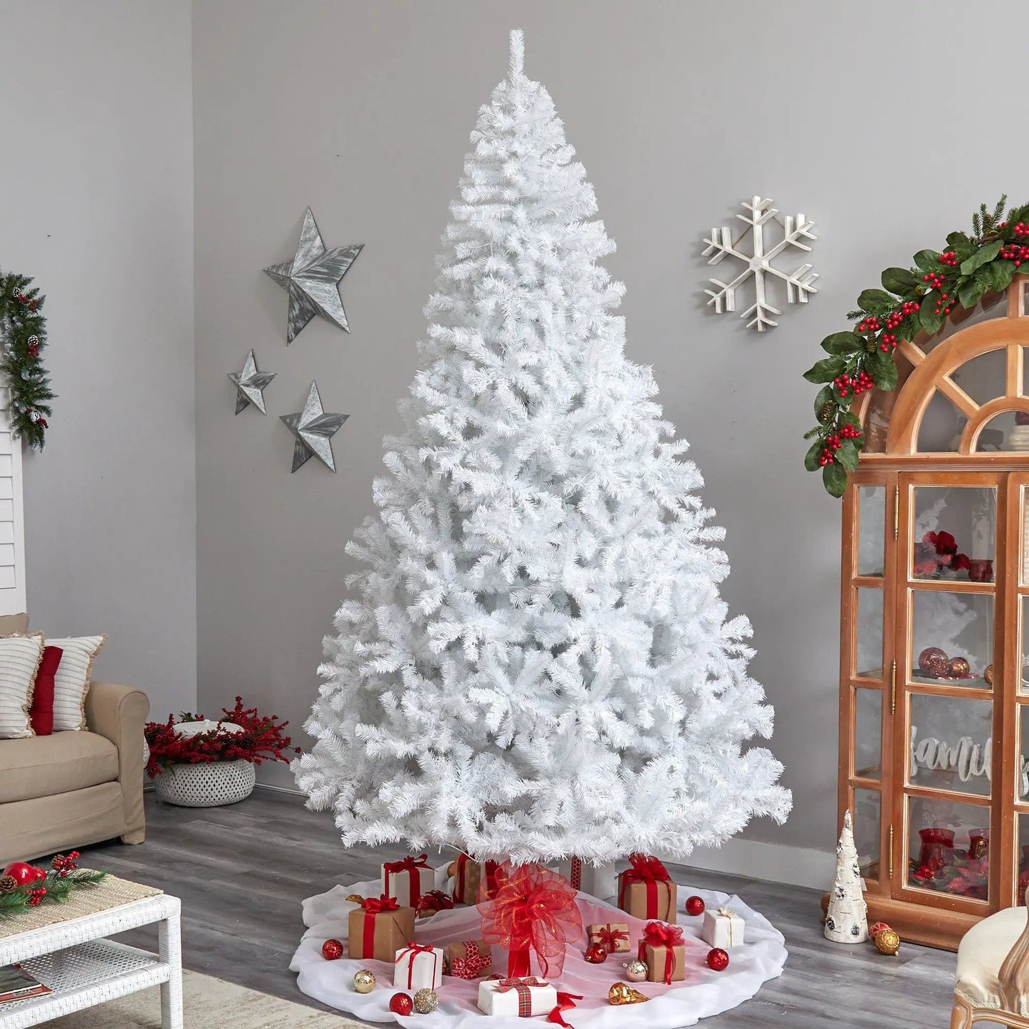 White 10 ft Nearly Natural artificial Christmas tree with 800 LEDs in a festive living room on Tampa Home & Garden Store