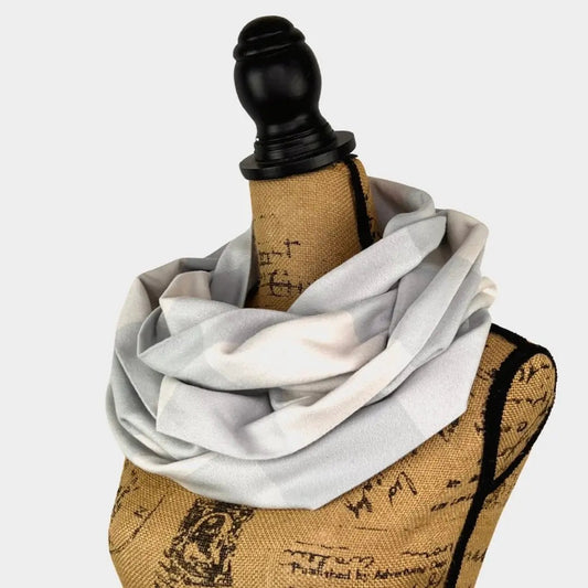 Buffalo Plaid Organic Cotton Infinity Scarf by Thistle & Stitch light gray draped on a mannequin on Tampa Home & Garden Store