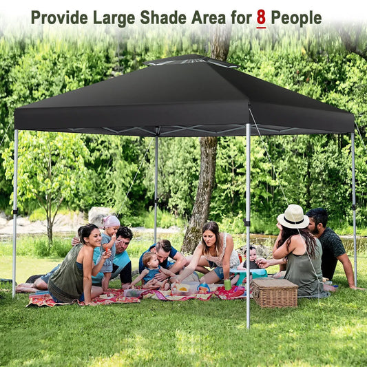Two Tier 10x10 Pop Up Canopy Tent with black canopy over a grassy outdoor picnic site on Tampa Home & Garden Store