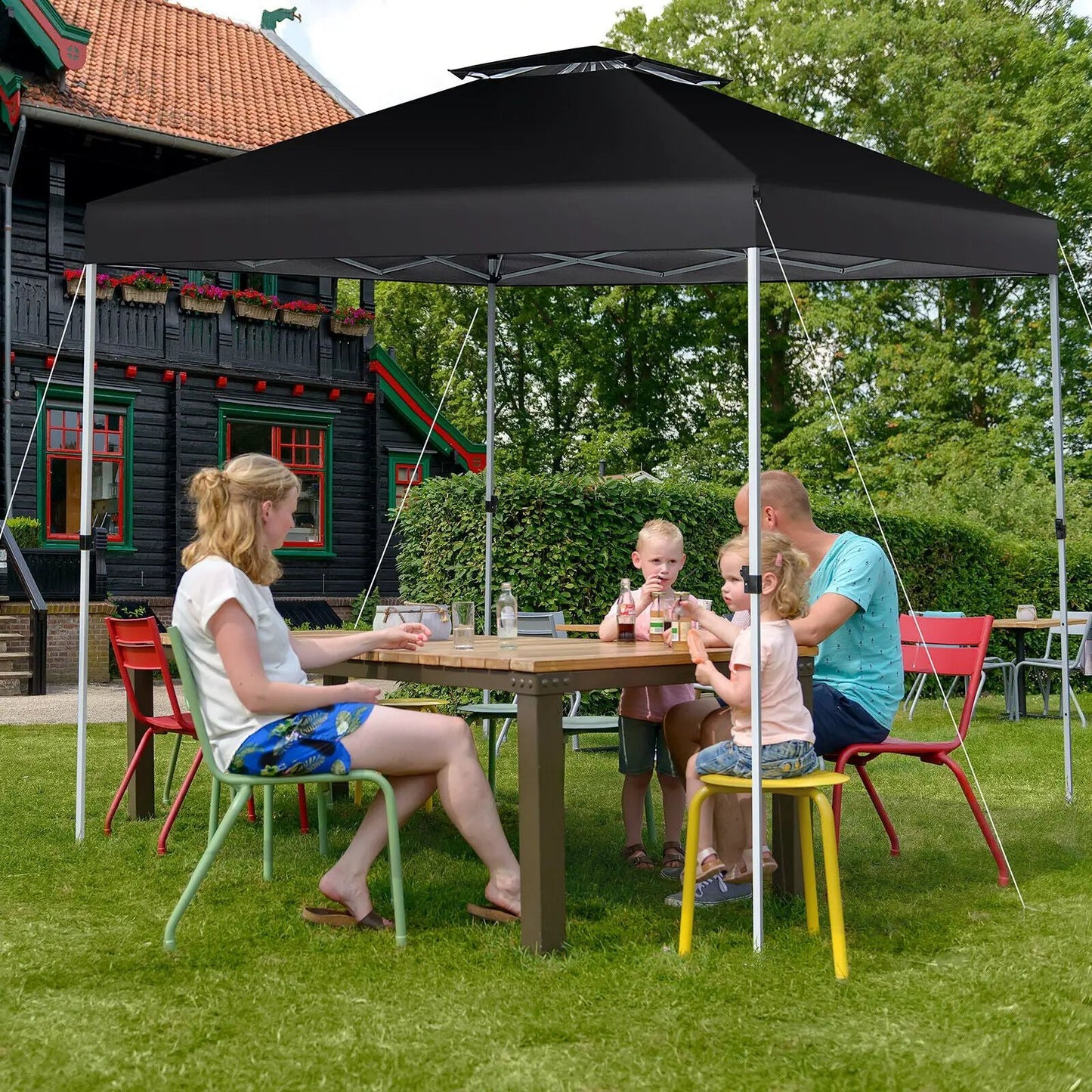 Two Tier 10x10 Pop-Up Canopy Tent in black with metal frame for outdoor gatherings on Tampa Home & Garden Store