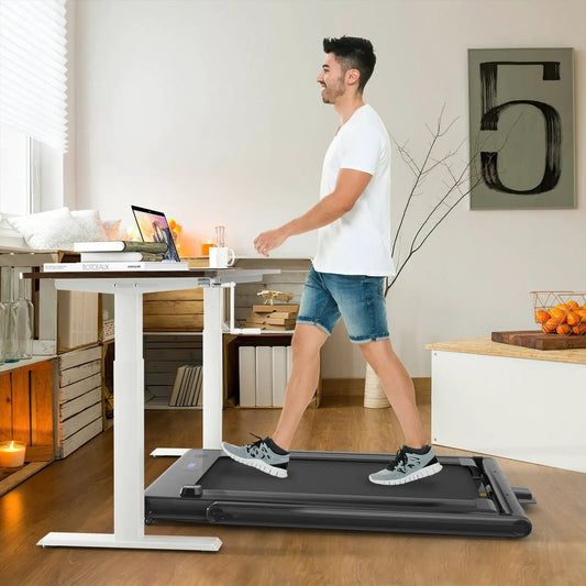 2-in-1 folding treadmill with dual LED display, black frame, man walking in a bright home office on Tampa Home & Garden Store