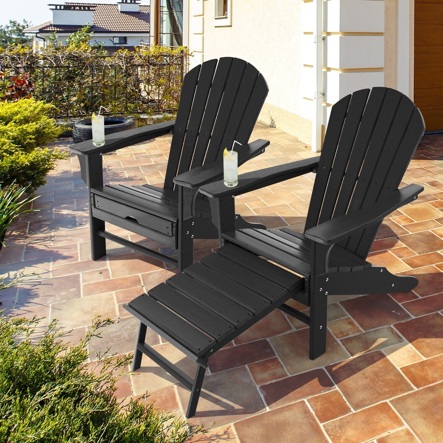 2 black HDPE Adirondack chairs with attached ottomans on tiled patio on Tampa Home & Garden Store