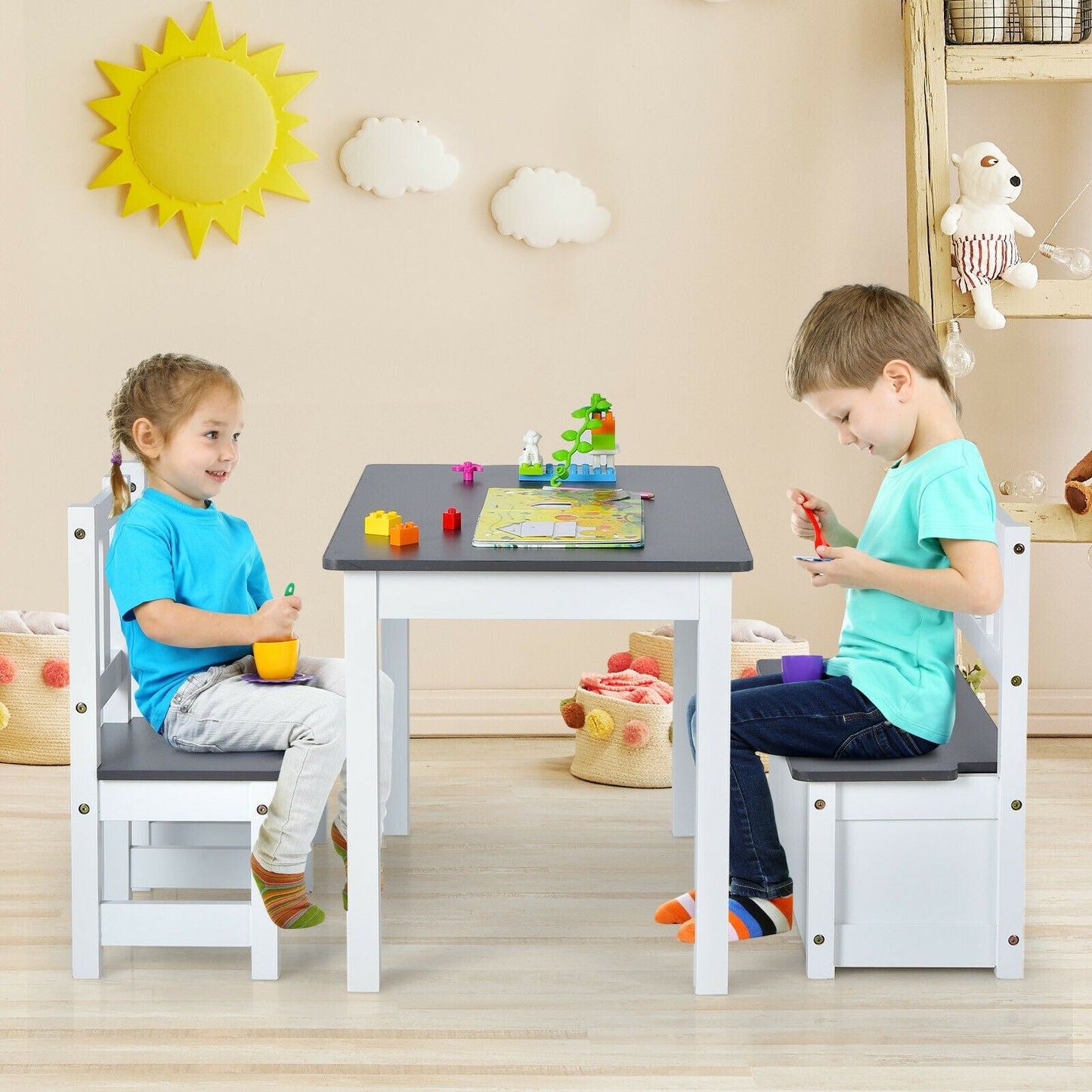 Kids wooden activity table with two white and gray chairs; two children play at the table on Tampa Home & Garden Store
