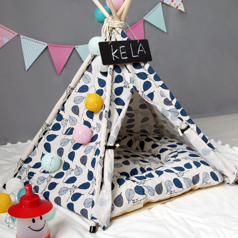 Dog kennel tent in blue leaf print fabric with cushioned interior by Sell My Stuff on Tampa Home & Garden Store