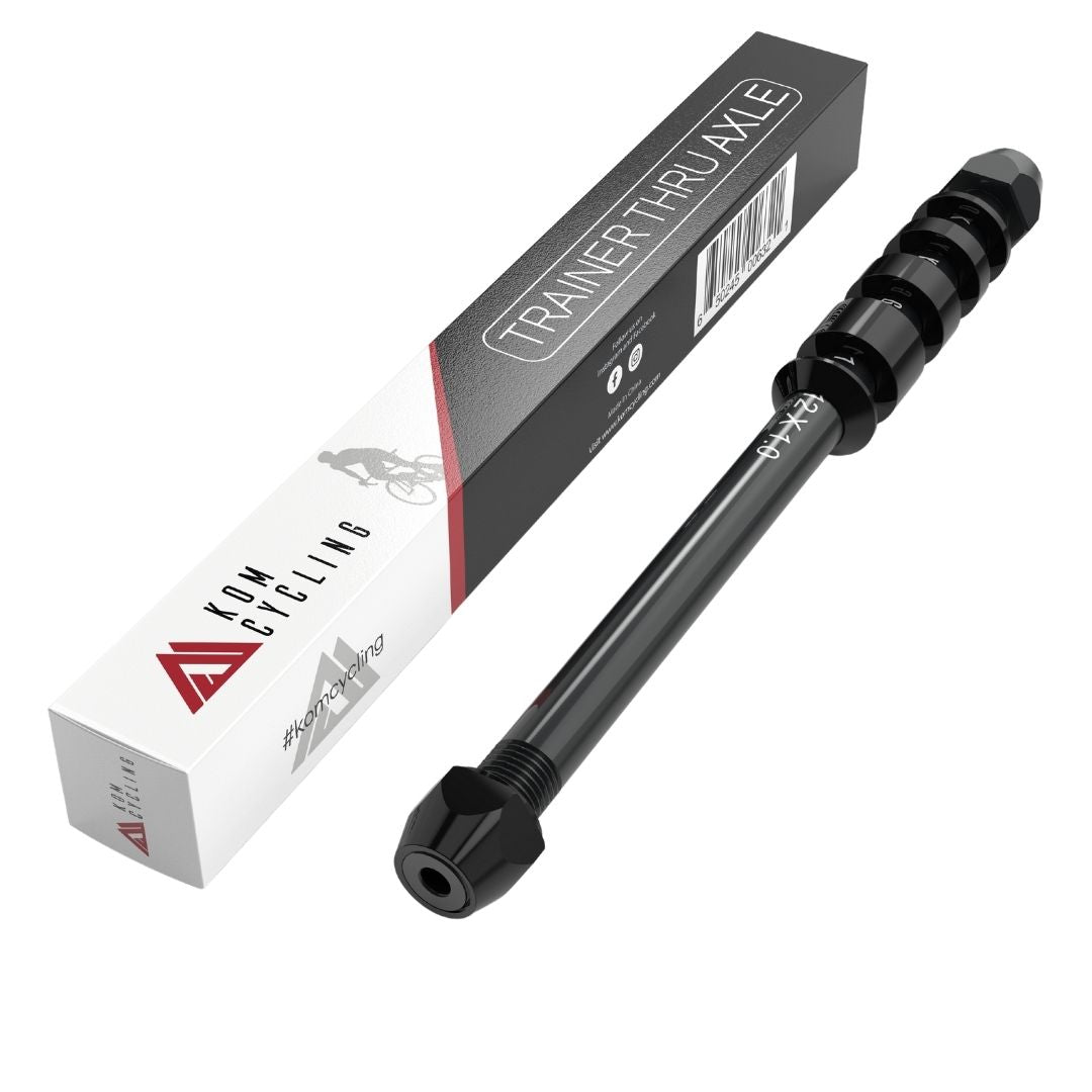 KOM Cycling Universal Thru Axle, black with knurled grip beside branded packaging box on Tampa Home & Garden Store