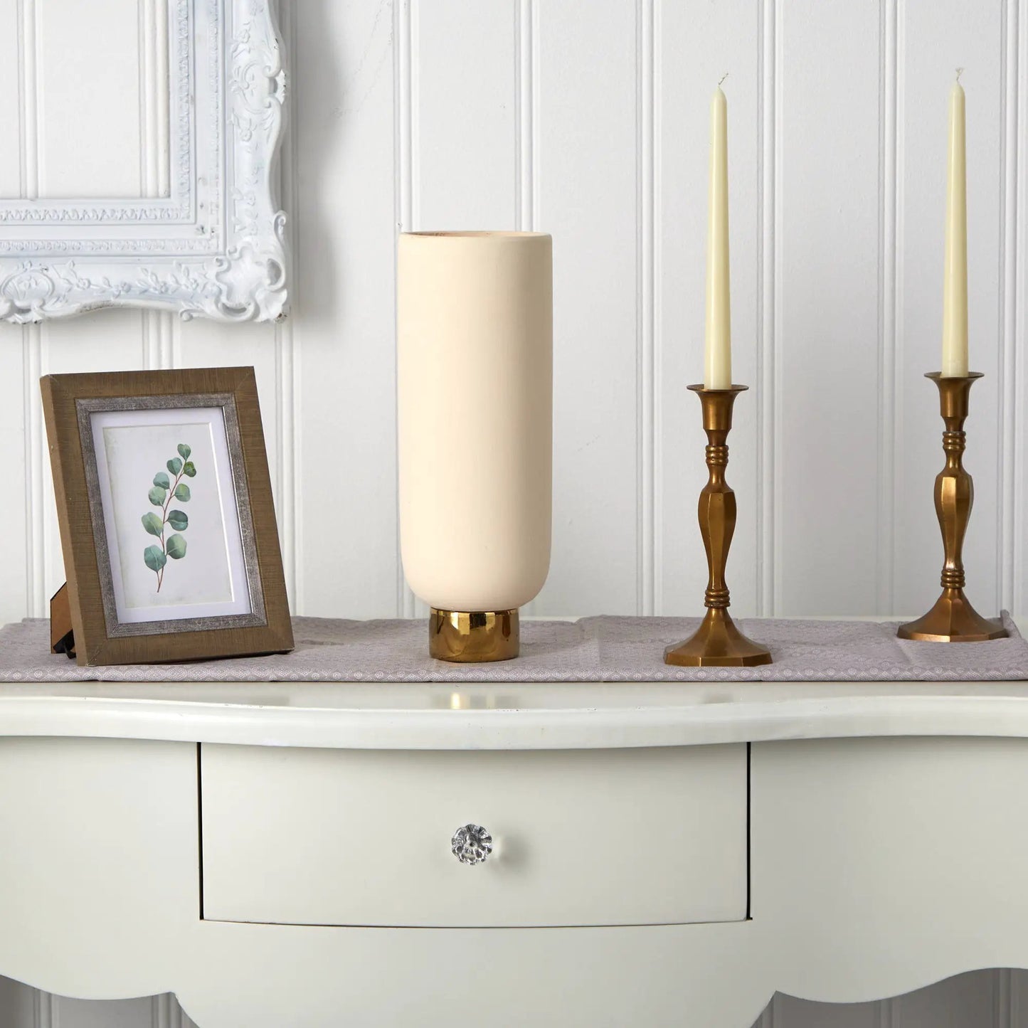 Elegance Ceramic Cylinder Vase with Gold Accents ivory finish, flanked by two brass candlesticks on Tampa Home & Garden Store