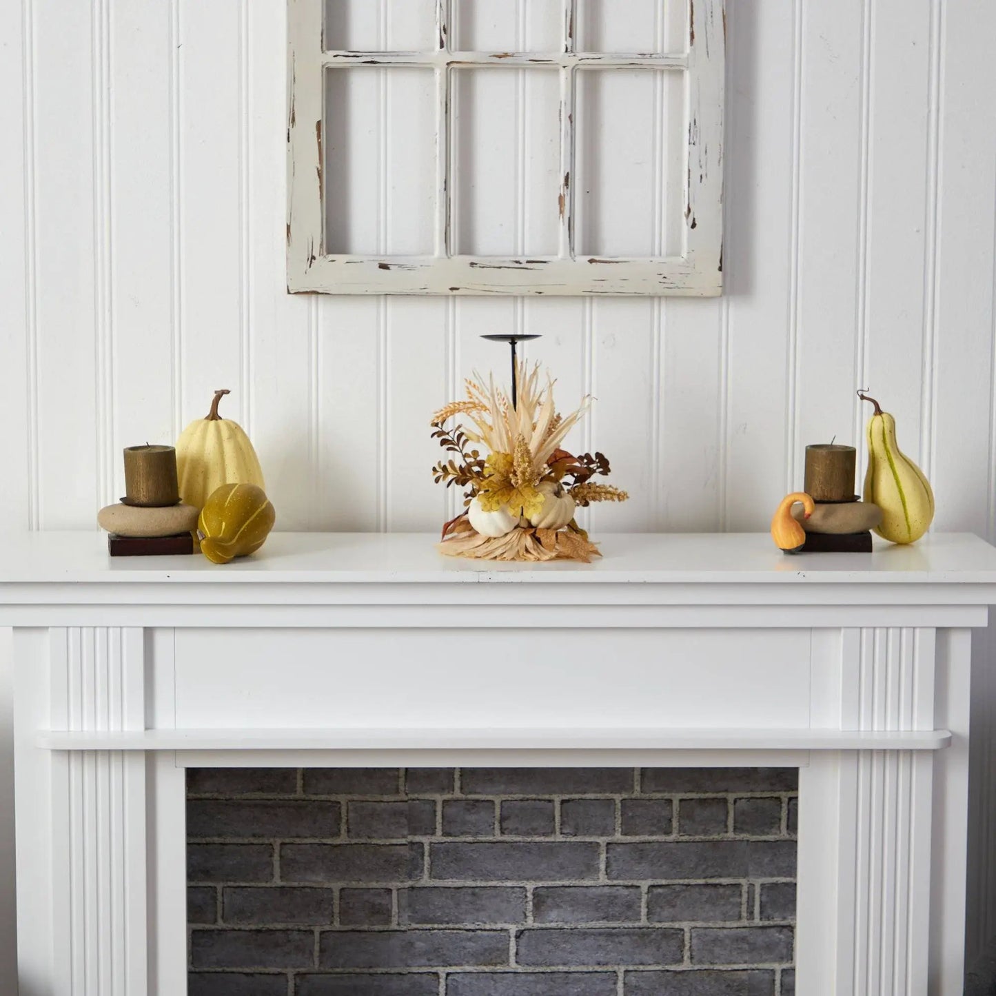 Autumn Harvest Pumpkin Fall Candle Holder candelabrum with a tall candle on a white mantel on Tampa Home & Garden Store