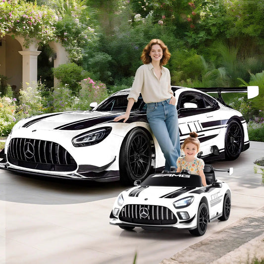 12V Mercedes AMG GT3 ride-on car with stripes; mom and child with AMG toy cars in a driveway on Tampa Home & Garden Store