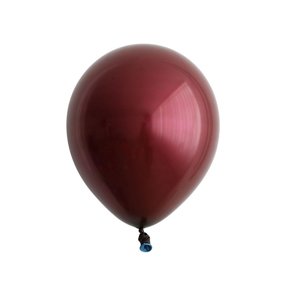 Single burgundy latex balloon with metallic gloss on white background on Tampa Home & Garden Store