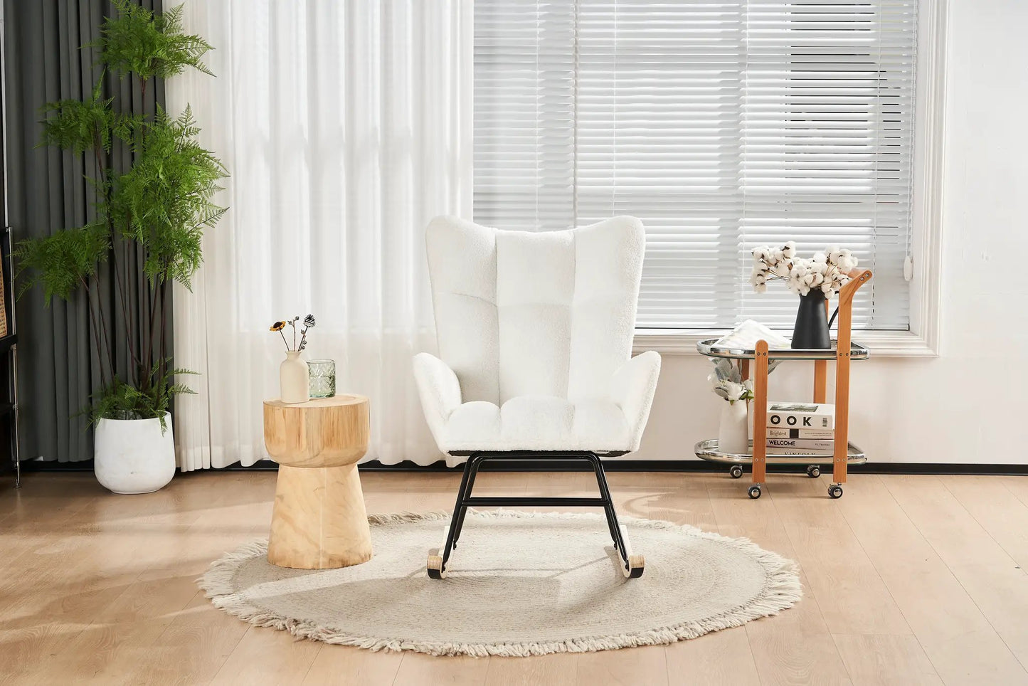 Rocking chair nursery with teddy fabric, white plush upholstery on black metal base in a room on Tampa Home & Garden Store