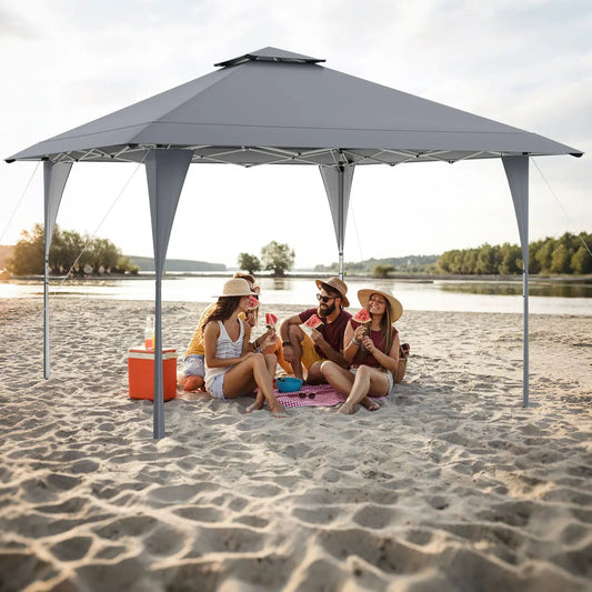 DirectDeals 13x13 ft pop-up gazebo with gray canopy on a sandy beach with stakes on Tampa Home & Garden Store