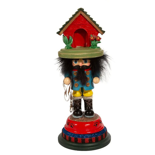 14 Inch Dog House Hat Nutcracker Ornament with blue coat, yellow pants, black boots on red/blue base on Tampa Home & Garden Store