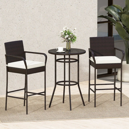 Patio rattan bar-height table with 2 brown wicker chairs and white cushions, glass top on Tampa Home & Garden Store