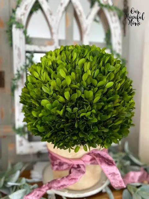 Artificial 15-inch green boxwood ball in planter with pink ribbon by Nearly Natural on Tampa Home & Garden Store