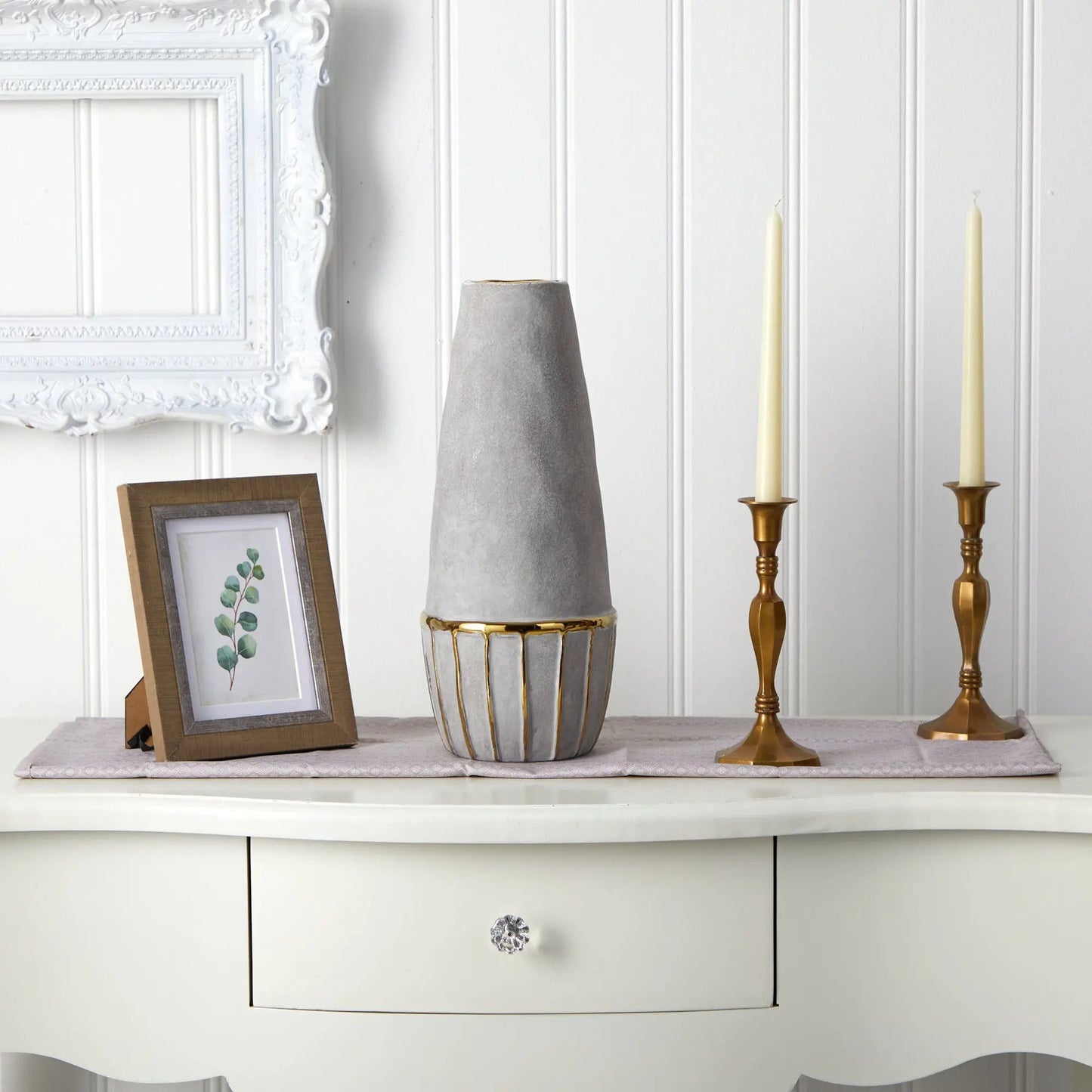 15 Inch Regal Stoneware Vase with Gold Accents gray ceramic vase with gold trim beside two brass candlesticks on white panel backdrop on Tampa Home & Garden Store
