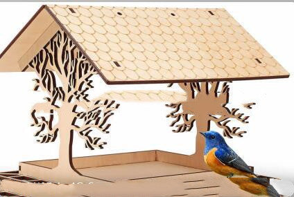 Wooden bird feeder with carved trees and blue bird accent Sell My Stuff on Tampa Home & Garden Store