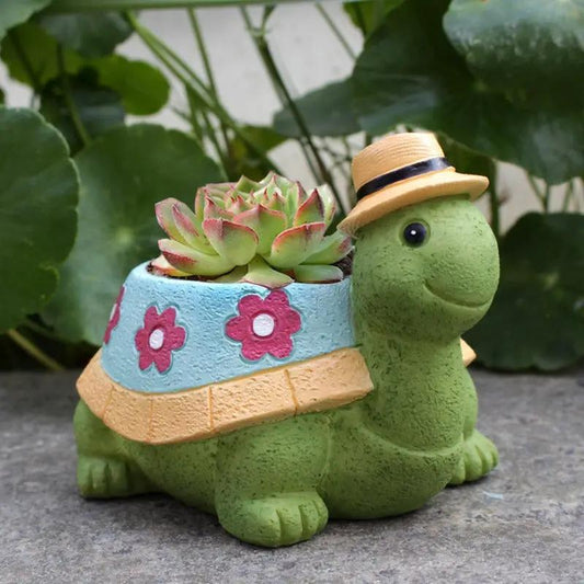 Turtle flower pot decoration; turtle with blue floral band and tan hat, succulent inside on Tampa Home & Garden Store
