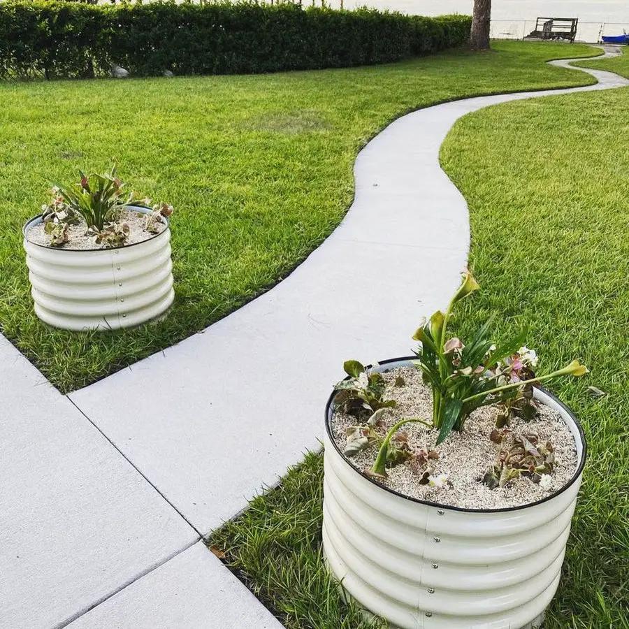 Vego Garden round mini planters, white ribbed two-pack with soil on curved lawn walkway on Tampa Home & Garden Store