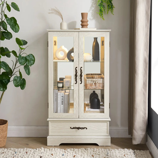 Lighted glass curio cabinet with shelves in whitewashed wood, glass doors and brass hardware on Tampa Home & Garden Store