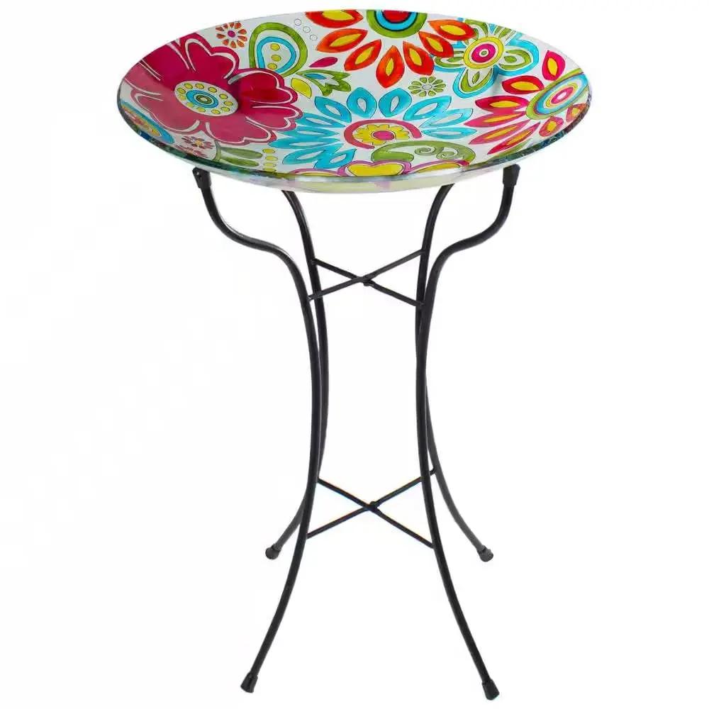 18-Inch Glass Bird Bath with colorful floral bowl on black metal stand on Tampa Home & Garden Store