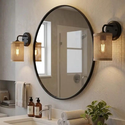 Reef wall sconces pair with wicker shades in black rattan finish beside round mirror on Tampa Home & Garden Store