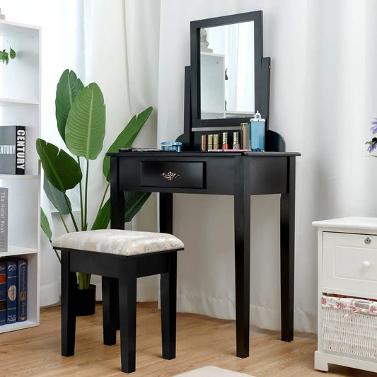 Black vanity dressing table with large mirror and cushioned stool, cosmetics displayed on Tampa Home & Garden Store