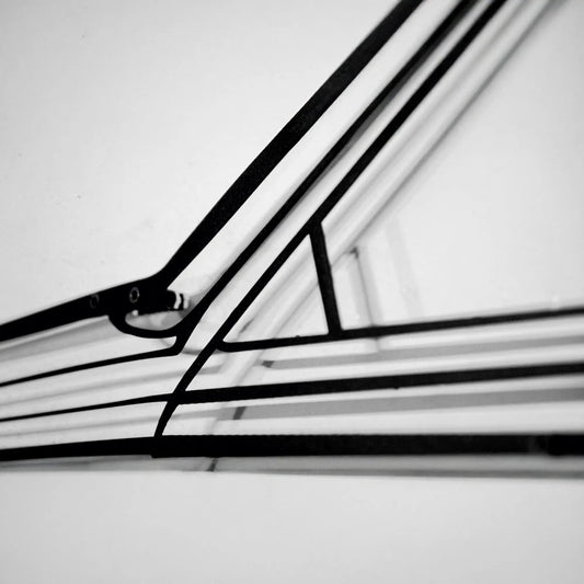 Metal car wall art silhouette in black steel with curved lines on light background on Tampa Home & Garden Store