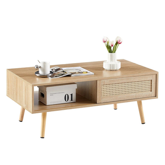 Natural rattan coffee table with sliding storage, light wood finish, woven front panel on Tampa Home & Garden Store