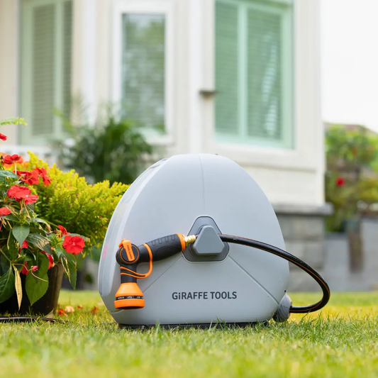 Ground Mounted Retractable Hose Reel 82 ft gray unit with orange nozzle by Giraffe Tools on Tampa Home & Garden Store