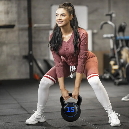 Kettlebell weight set 5 10 15 lbs black kettlebell with blue 15 label in gym on Tampa Home & Garden Store
