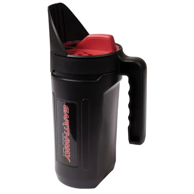 Earthshaker Hand Spreader, black plastic handheld tool with red interior and ergonomic grip on Tampa Home & Garden Store