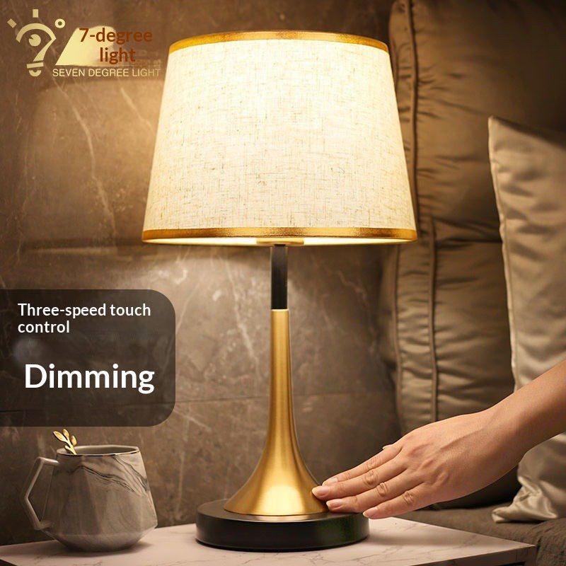 Stevvex ST125099AYL table lamp with gold base and beige shade; dimmable LED with touch control on Tampa Home & Garden Store
