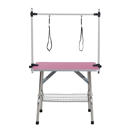 Folding dog grooming table with stainless steel frame, pink mat, adjustable arm and clamps on Tampa Home & Garden Store