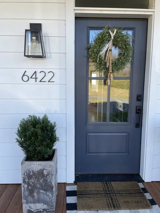 Artificial Cedar Bush by Nearly Natural with green wreath on door and cedar shrub in planter on Tampa Home & Garden Store
