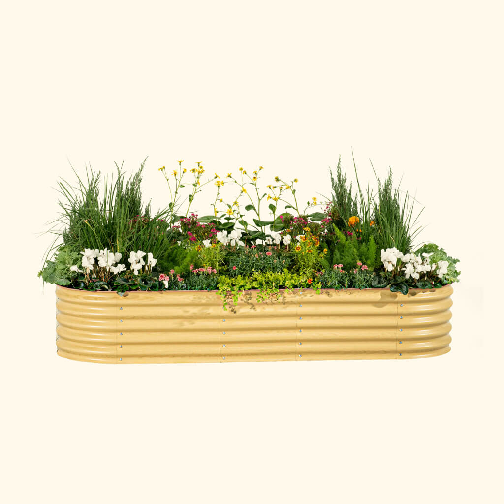 Gold ribbed raised garden bed filled with tall grasses and colorful flowers on Tampa Home & Garden Store