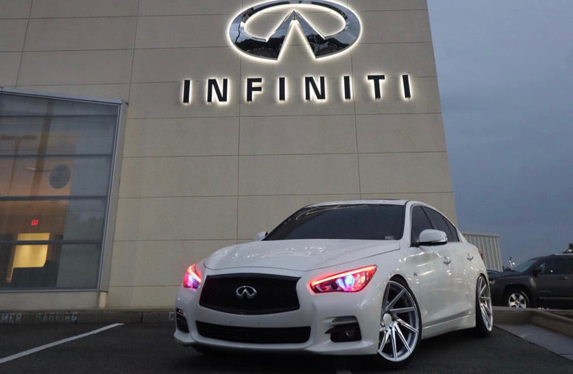 Infiniti Q50 RGBW Flow Series LED DRL boards on white Infiniti sedan at dealership on Tampa Home & Garden Store