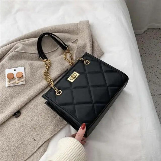Stevvex black quilted PU leather shoulder bag with gold chain strap and turn-lock clasp on Tampa Home & Garden Store