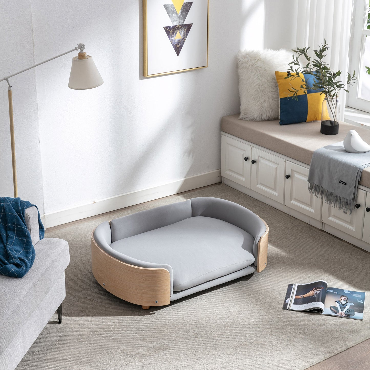 Scandinavian style elevated dog bed with solid wood legs and light blue velvet cushion on Tampa Home & Garden Store