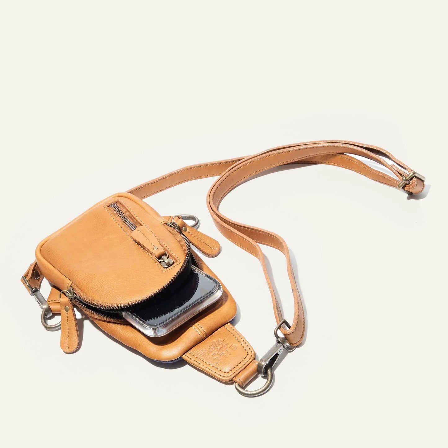 Handcrafted leather mini sling bag by Will Leather Goods, tan crossbody with zipper pocket on Tampa Home & Garden Store