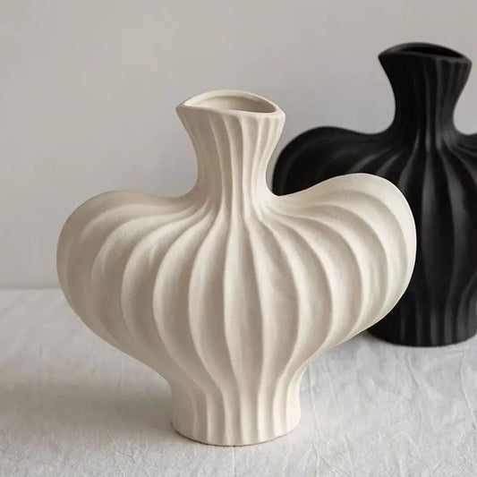 Plastic imitation ceramic vase ribbed bulb with neck; black vase behind, two vases on show on Tampa Home & Garden Store