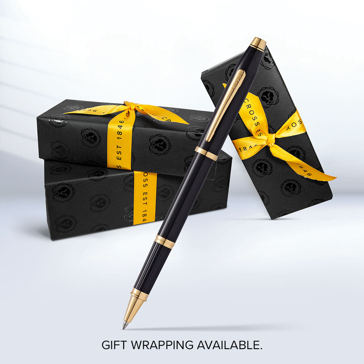 Cross Century II Classic Black Rollerball Pen with gold trim beside gift boxes on Tampa Home & Garden Store