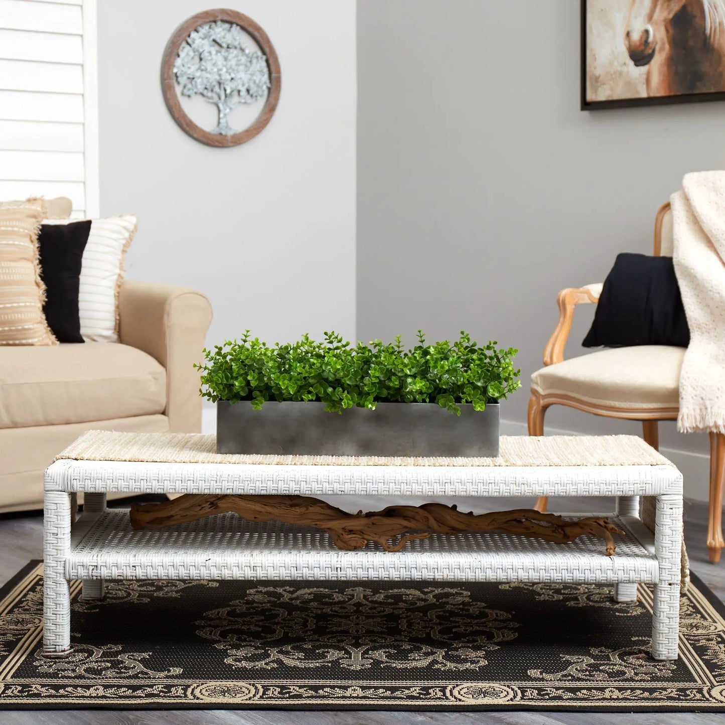 25 Inch eucalyptus artificial plant in a gray rectangular planter on a white wicker coffee table on Tampa Home & Garden Store